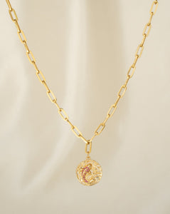 colourful small zirconias creating a koi fish on a disc pendant. paired with a link chain in 18k gold filled