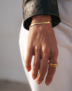 snake chain bracelet and striped ring